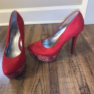 Red snakeskin high heels